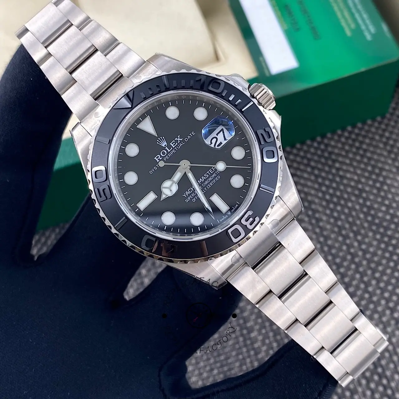 Three-quarter front view of Rolex Yacht-Master 226627-0001 with Oyster bracelet on display cushion.