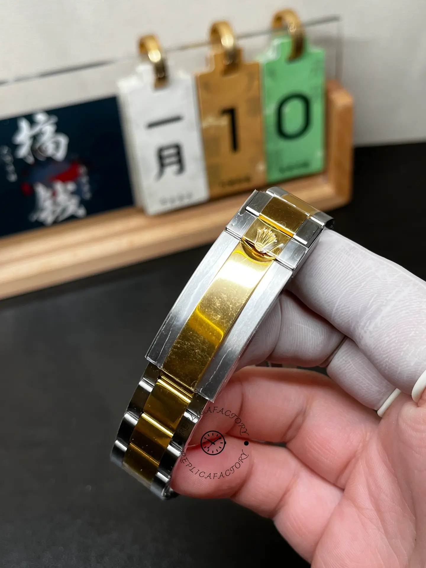 Clasp view of Rolex Submariner 126613LN-0002 replica showing two-tone Oyster bracelet and crown logo clasp.