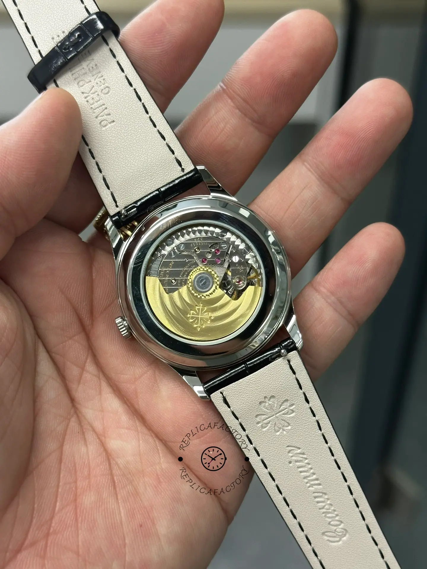 Caseback view of Patek Philippe Calatrava 5196G-001 showing movement and rotor through sapphire back.