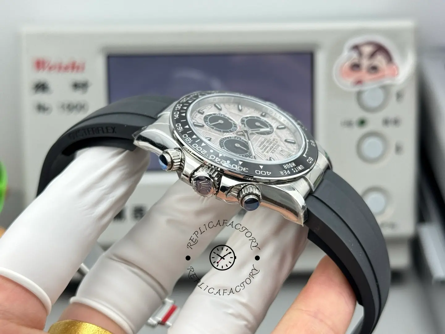 Crown and pusher side view of Rolex Daytona 116519 with black ceramic bezel and Oysterflex strap.