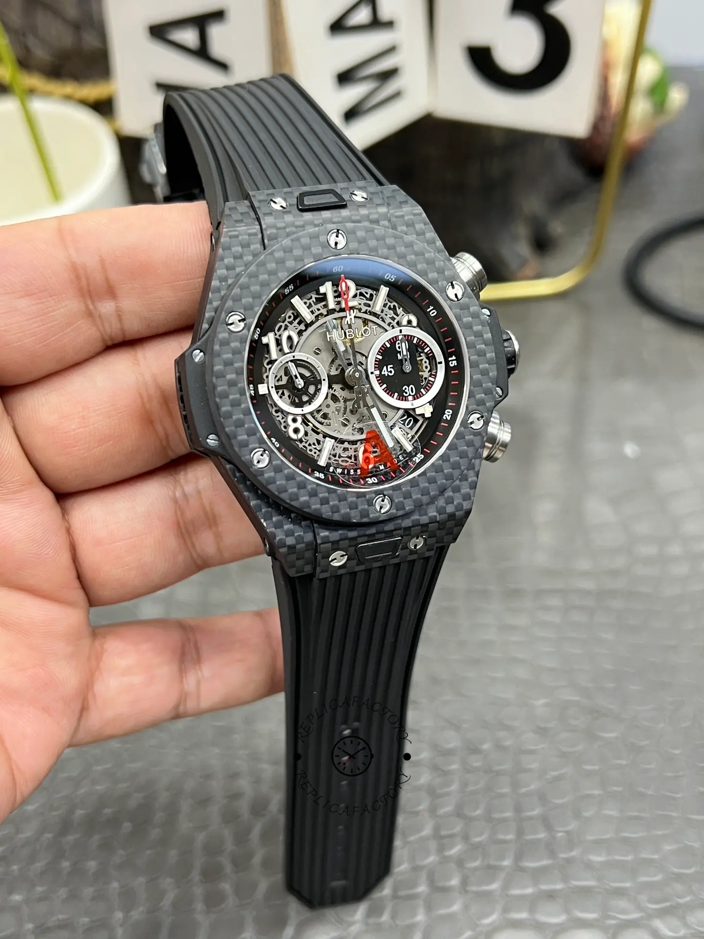 Hublot Big Bang UNICO 411.QX.1170.RX wrist/hand view, skeleton chronograph layout highlighted.