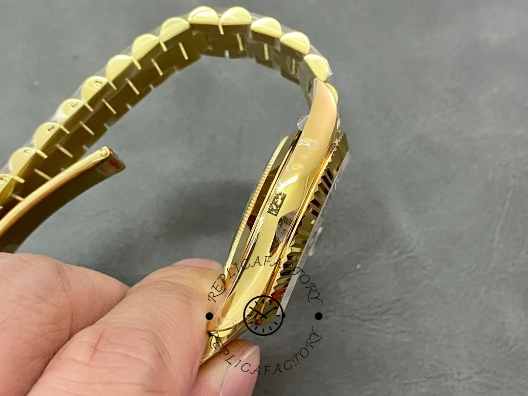 Side profile in hand of Rolex 228238-0061 showing case thickness and bracelet curve.
