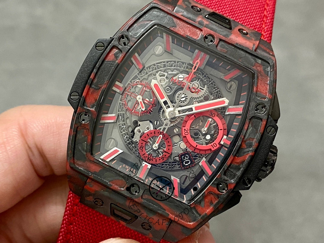 Hublot Big Bang 642.QV.0113.NR.CNY21 close-up showing red strap and bezel screw details.