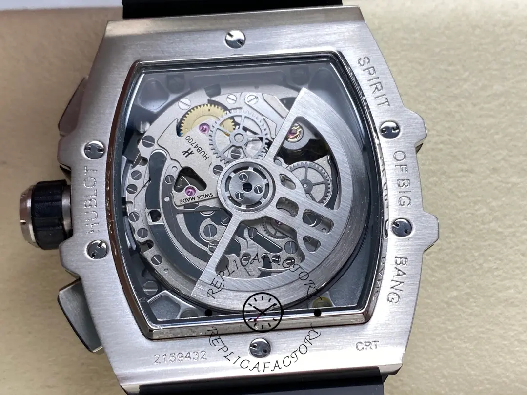 Caseback view of Hublot 642.NE.2010.RW.1604 showing exhibition back and rotor with black ribbed strap attached.