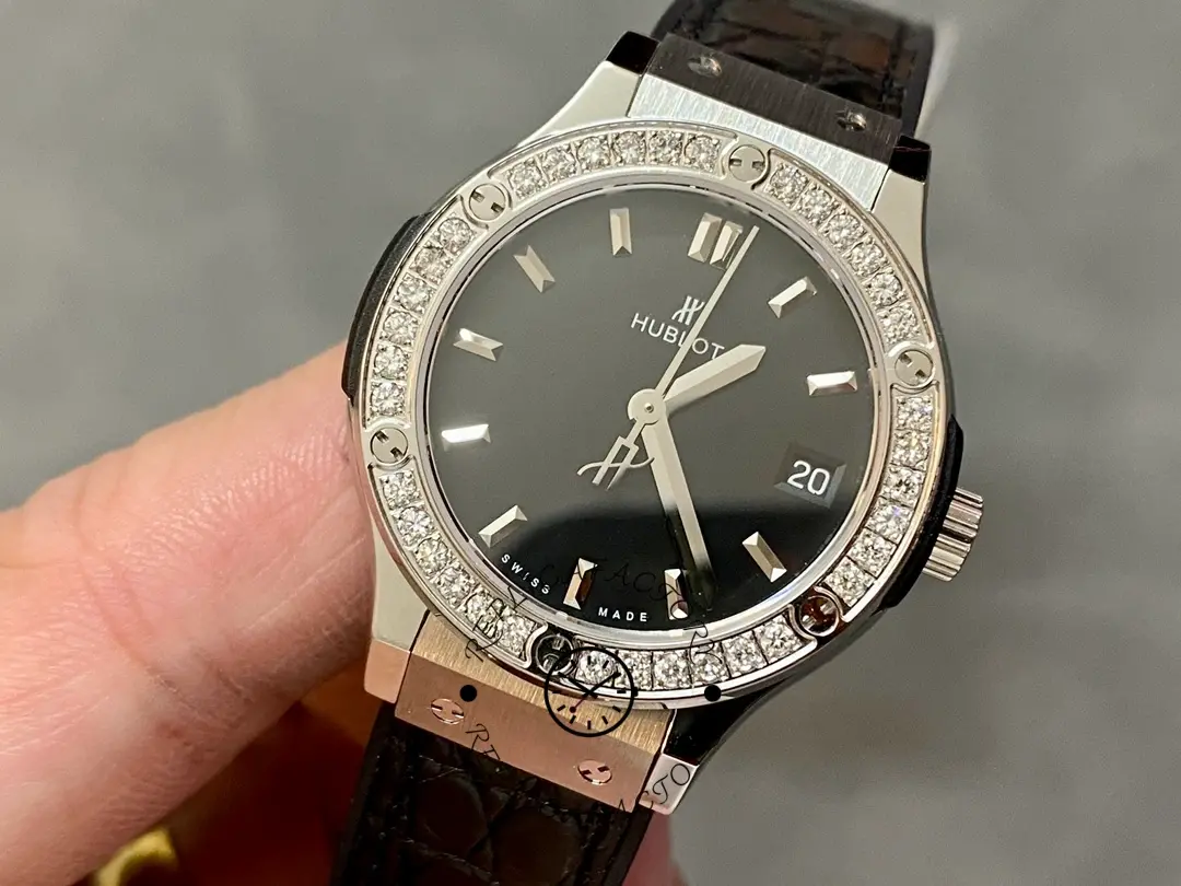 Hublot Classic Fusion 581.NX.1171.LR.1104 angled view, slim black dial and diamond-set bezel.