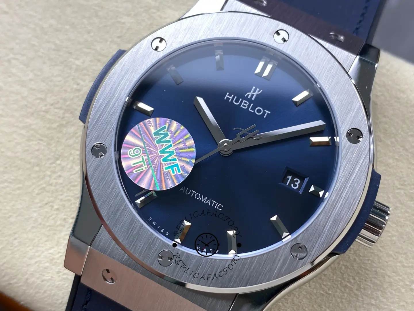 Angled close-up of Hublot Classic Fusion 542.NX.7170.LR showing hands, logo and minute track.