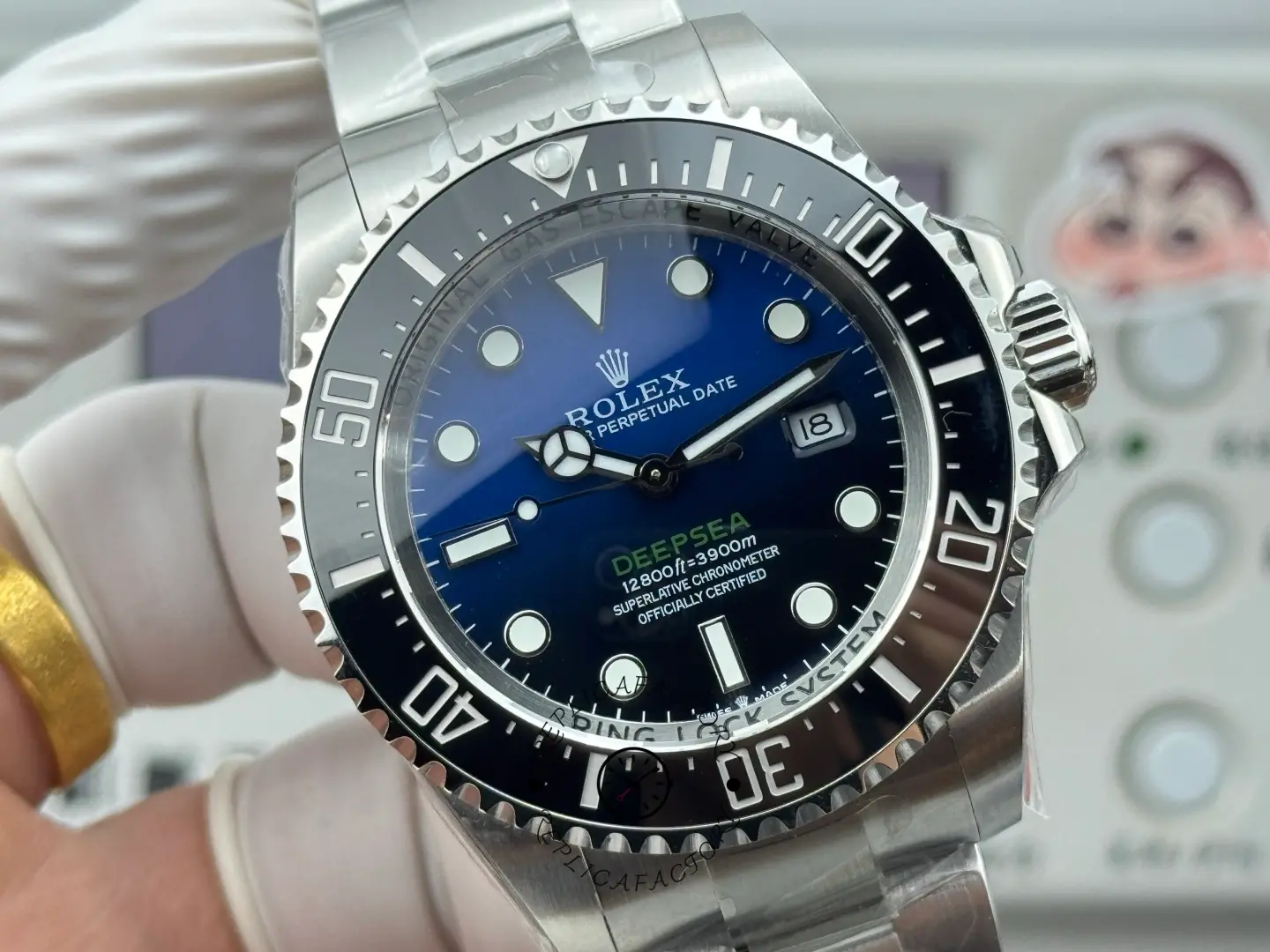 Angled dial view of Rolex Sea-Dweller Deepsea 116660 showing ceramic bezel, rehaut text, and crown guards.