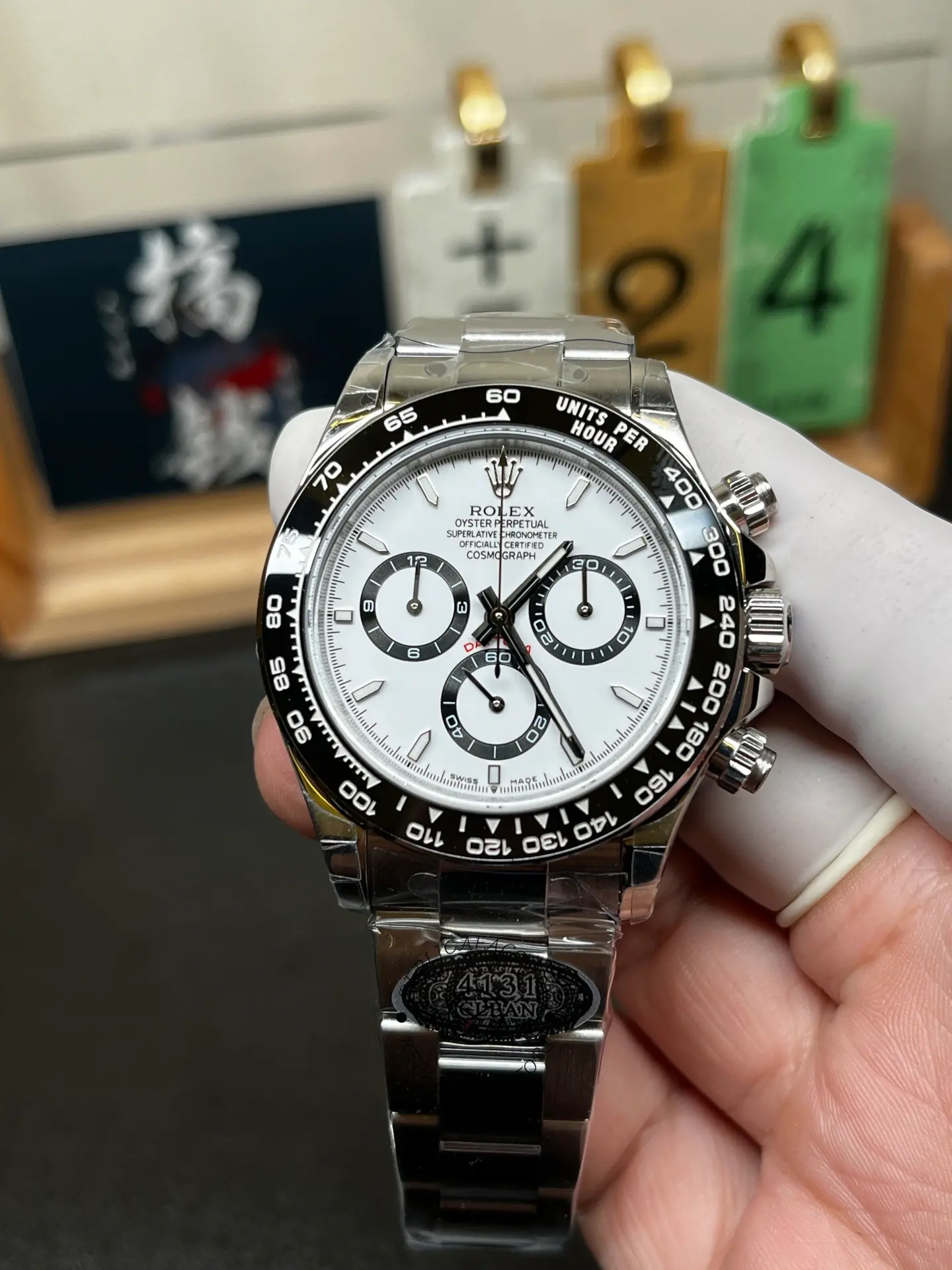 Front view of Rolex Cosmograph Daytona M126500LN-0001 with white panda dial, black bezel and Oyster bracelet.