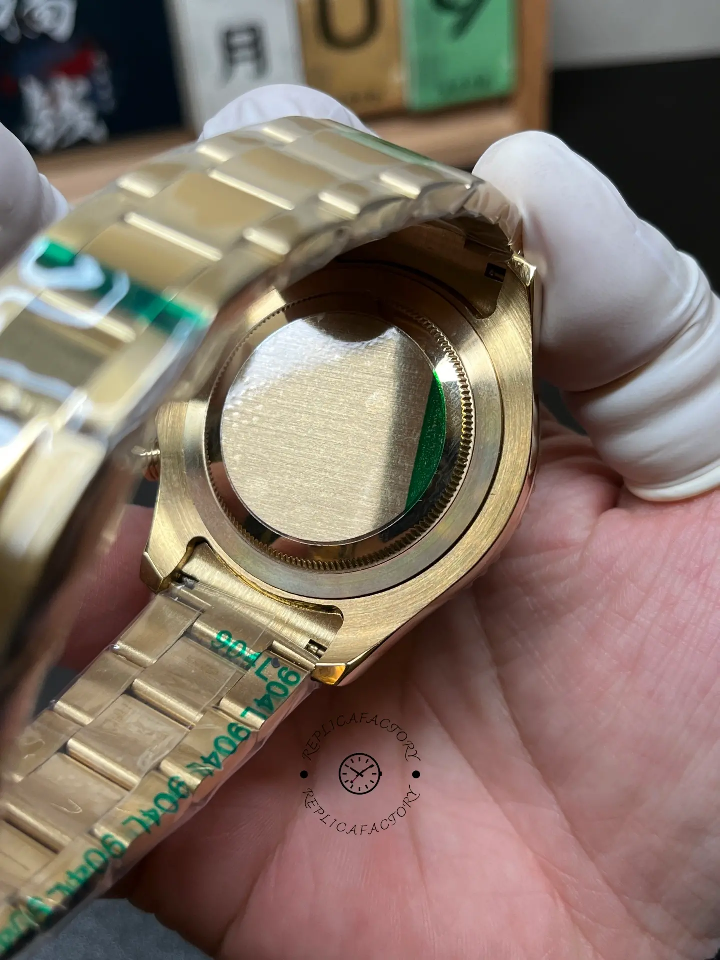 Case back view of Rolex Yacht-Master II 116688 with solid back and wrapped gold-tone bracelet.