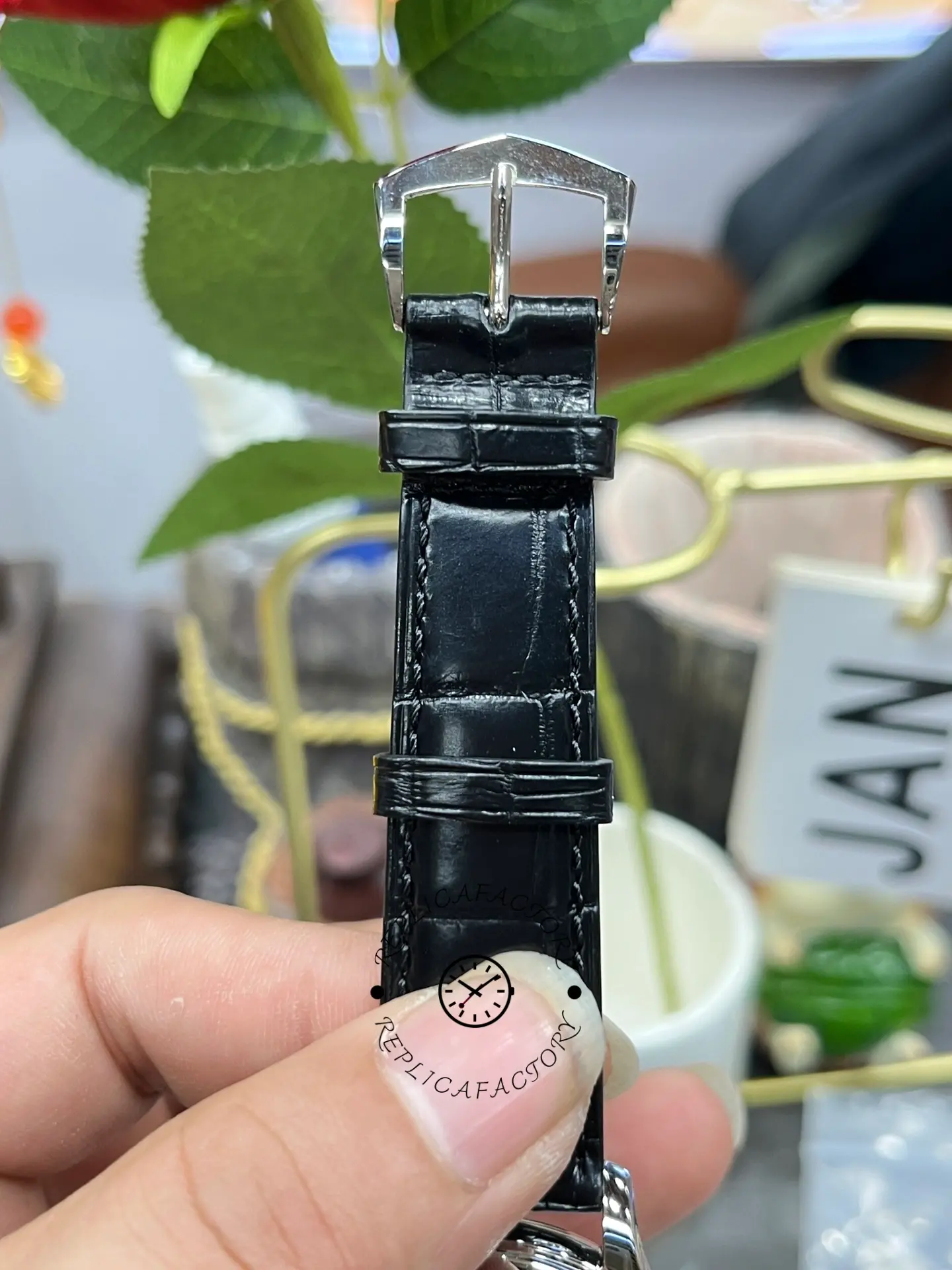 Buckle close-up of the Patek Philippe Calatrava 5227G-001 showing the clasp hardware and strap end.