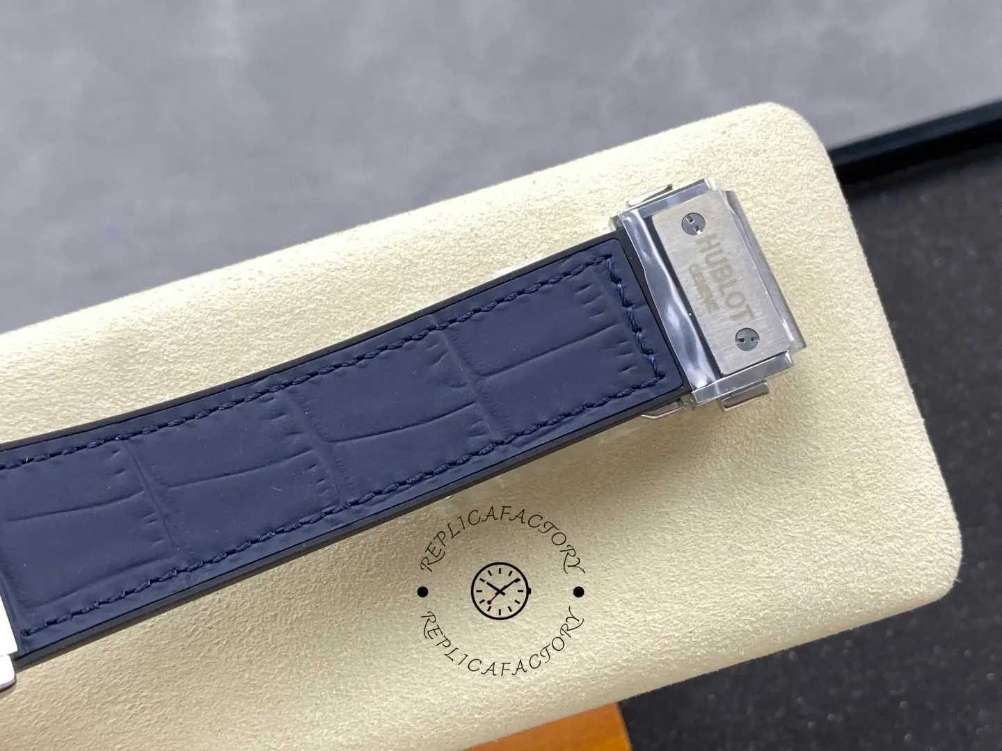 Strap laid flat: Hublot Classic Fusion 542.NX.7170.LR blue leather strap with buckle end shown.