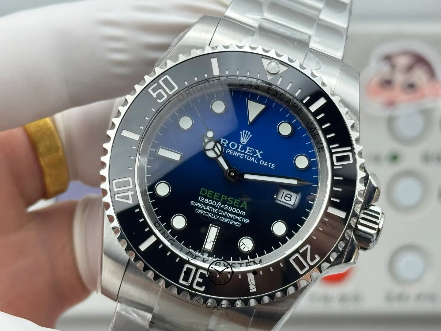 Dial close-up of Rolex Sea-Dweller Deepsea 116660 showing “DEEPSEA” text and date window detail.