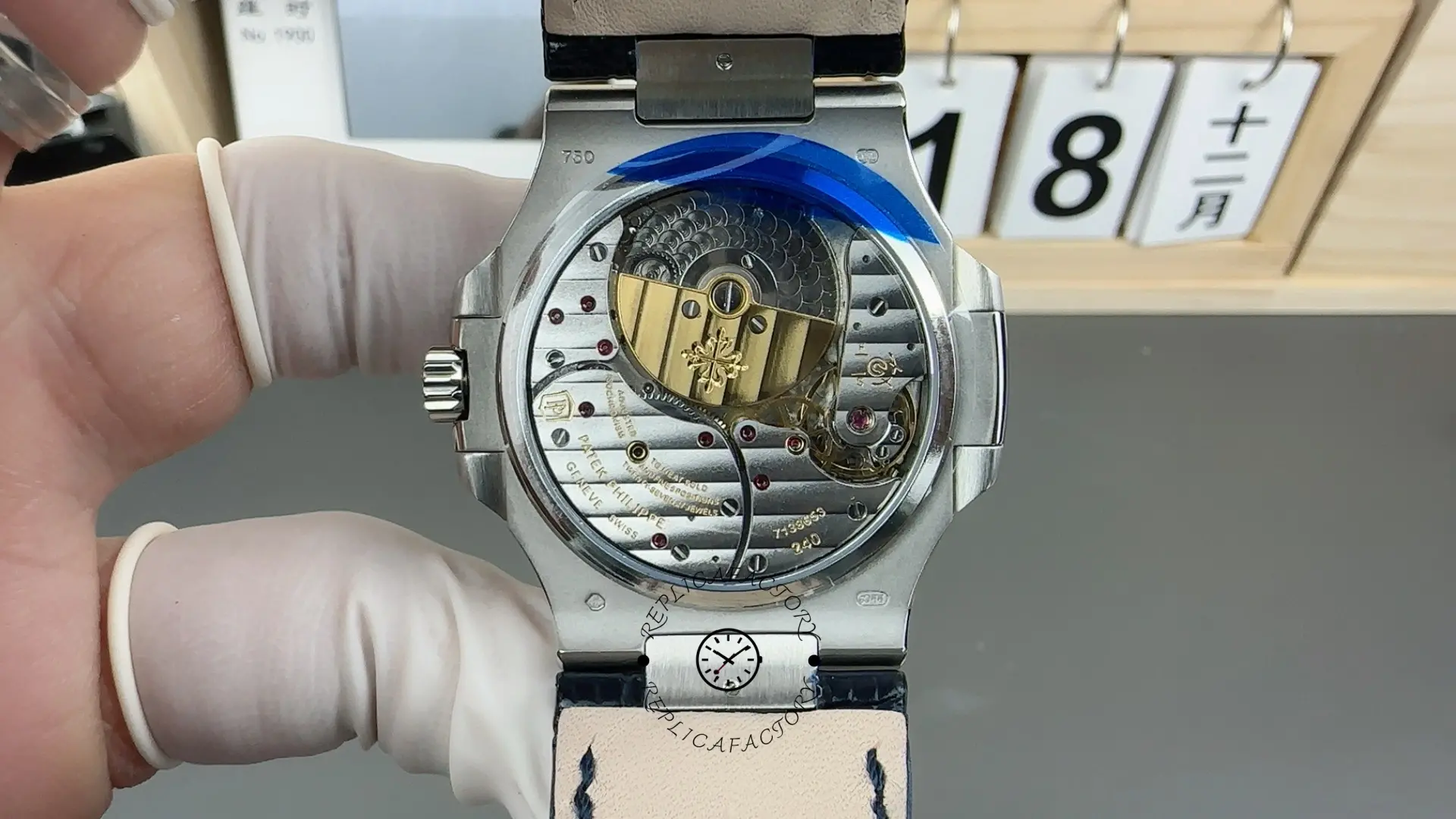 Exhibition caseback of Patek Philippe Nautilus 5724G-001 showing gold rotor and movement details.