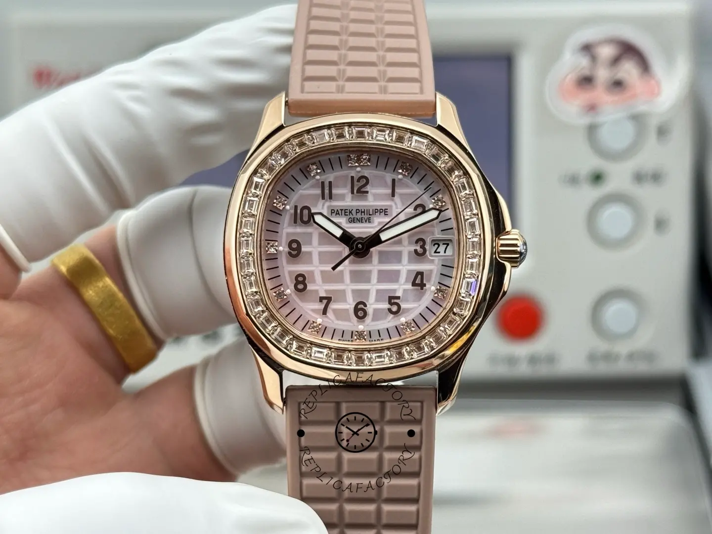 Front view of the Patek Philippe Aquanaut 5072R-001 showing diamond bezel and pink textured dial.