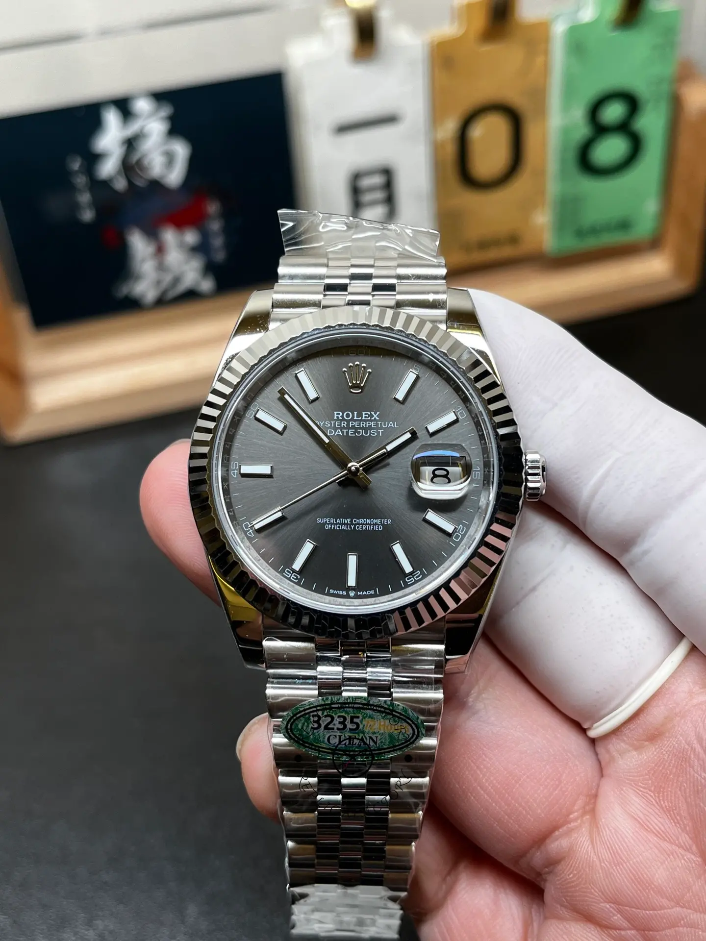 Front view of Rolex Datejust 126334-0014 showing grey dial, fluted bezel, Jubilee bracelet and date magnifier.