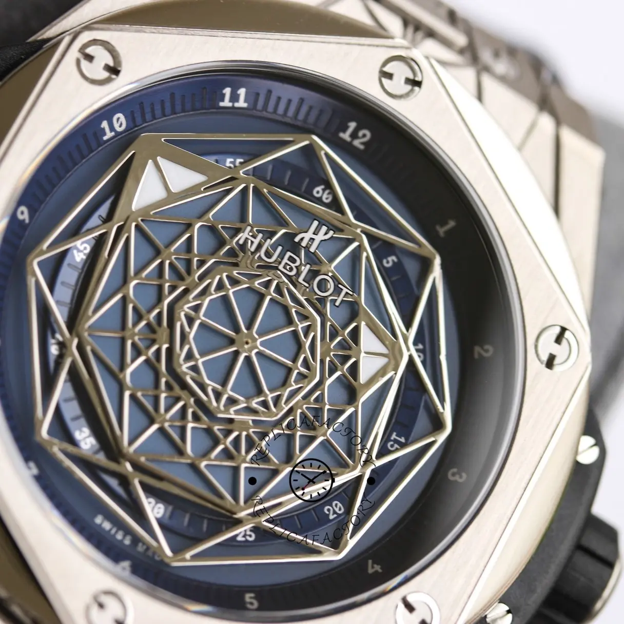 Close-up of Hublot Big Bang 415.NX.1112.VR.MXM16 blue dial, showing the geometric motif and bezel.