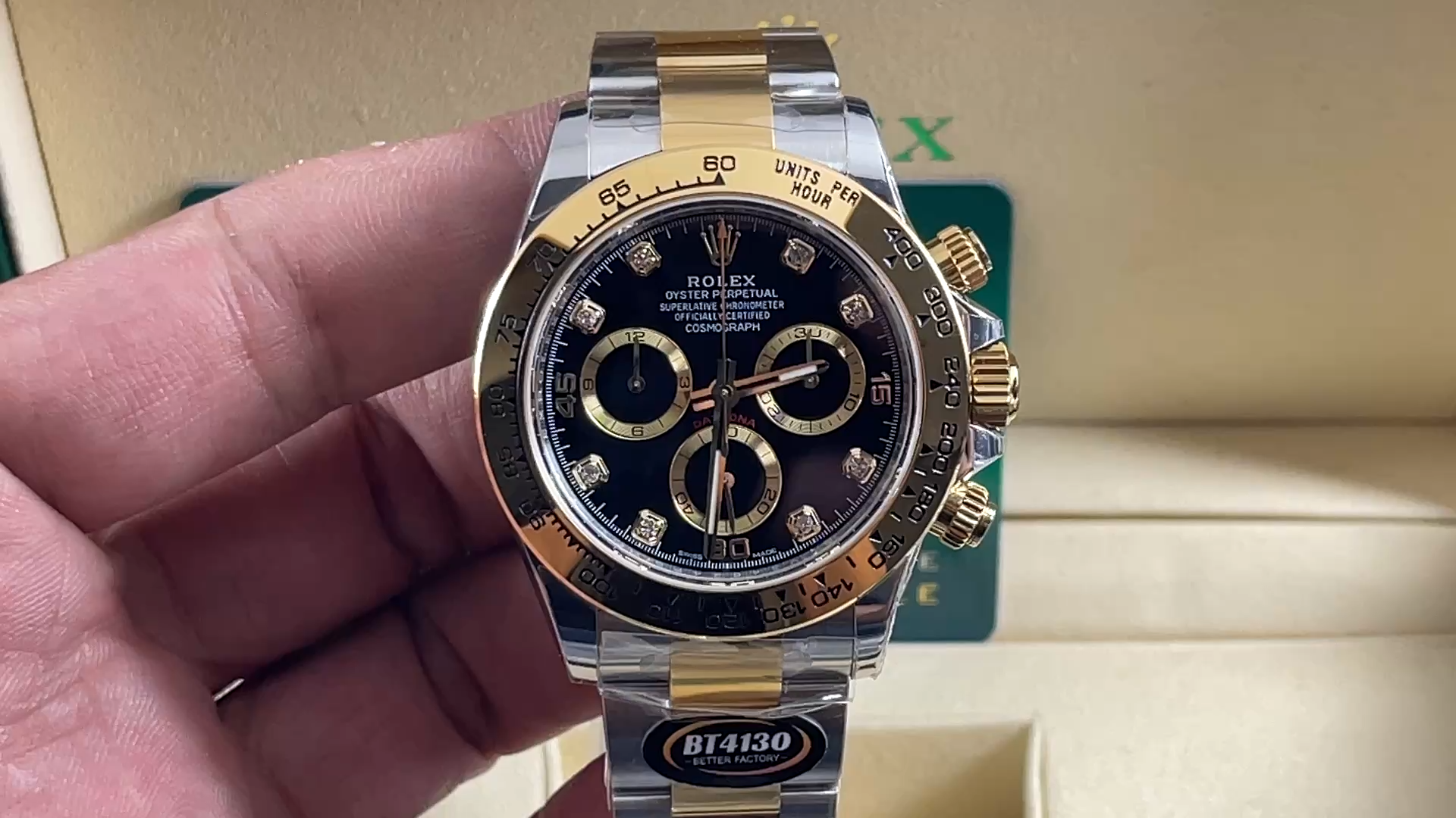 Rolex Daytona 116503 video, handheld view of black diamond dial and gold bezel. - Video