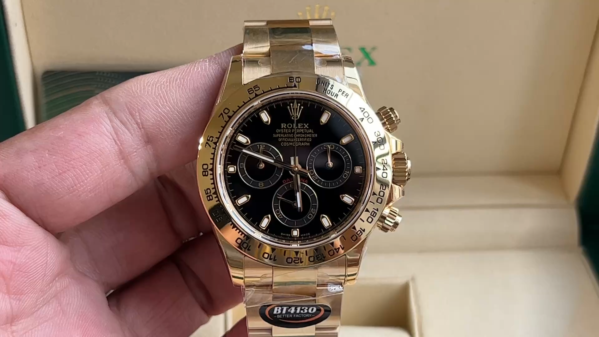 Rolex Daytona 116508 video, handheld view of black dial and gold bezel. - Video