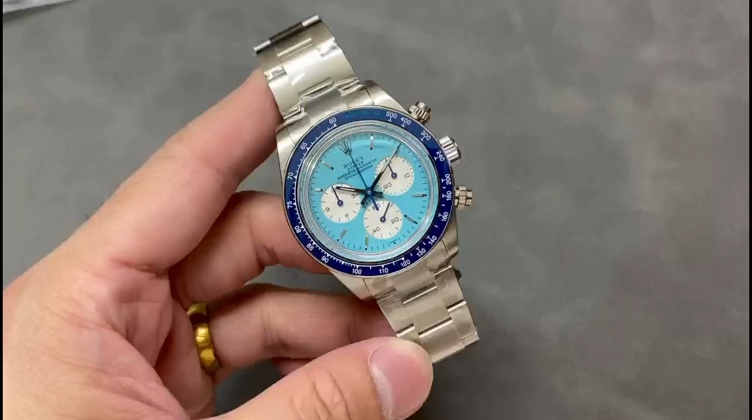 Video: hand holding Rolex Daytona ADG Scona Edition, ice blue dial and blue bezel visible. - Video