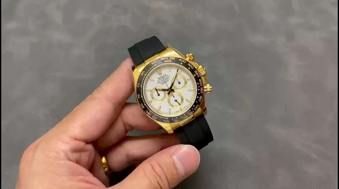 Video of Rolex Daytona 126518LN, hand-held shot showing gold case and Oysterflex. - Video