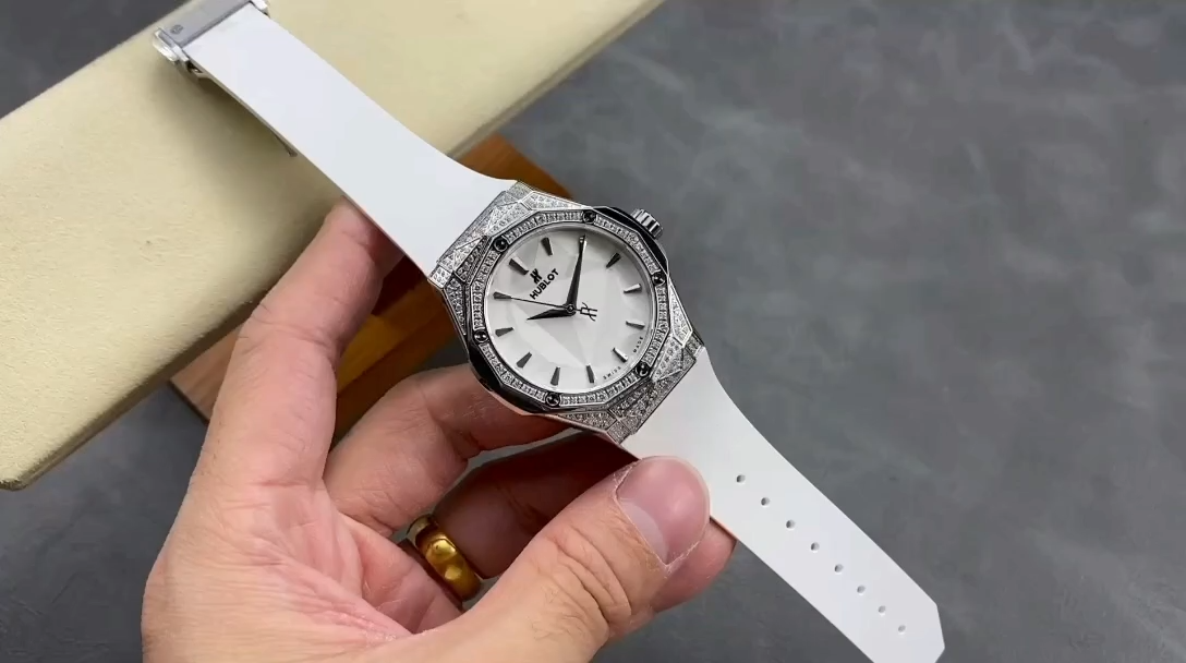 Handheld shot of Hublot Classic Fusion 550.NS.2200.RW.1604.ORL20 showing full dial and bezel sparkle. - Video