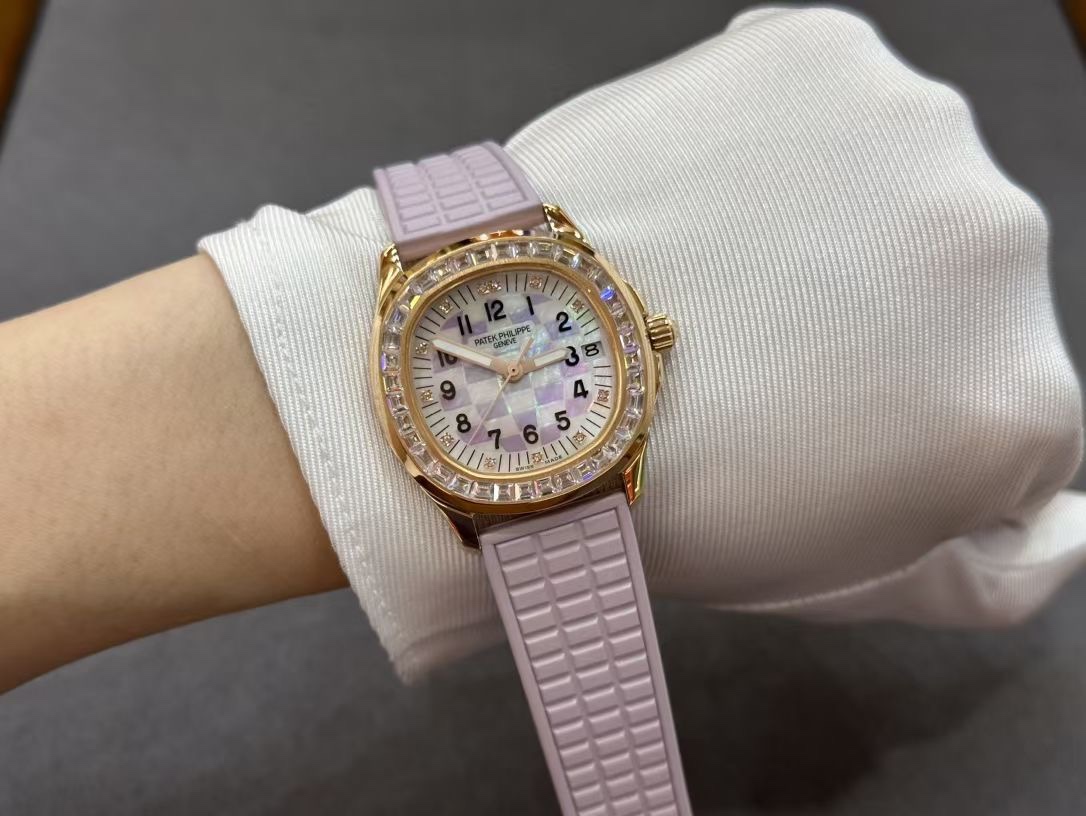 Wrist shot of Patek Philippe Aquanaut 5072R-001 showing lilac strap fit and diamond bezel.