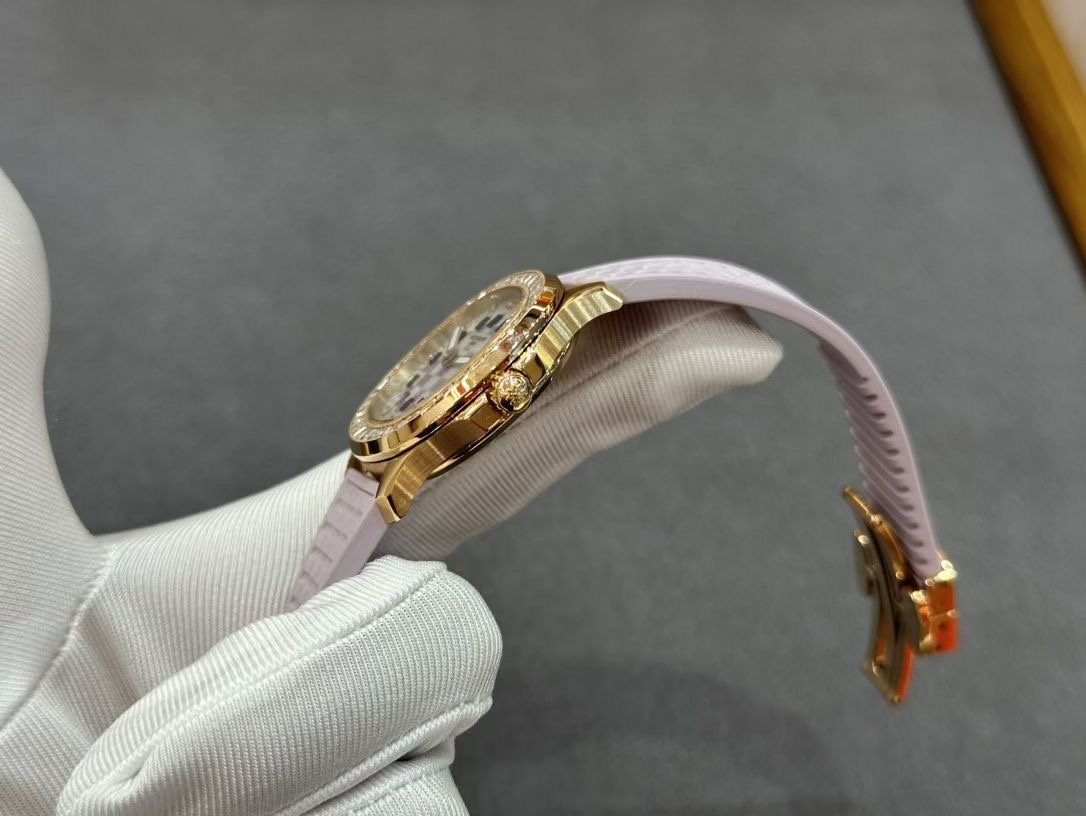 Side angle in glove of Patek Philippe Aquanaut 5072R-001 showing crown and case edge finish.