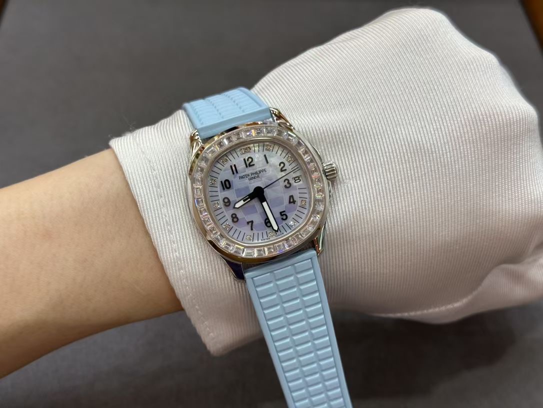 Wrist shot of Patek Philippe Aquanaut 5072G-001 showing diamond bezel and light-blue strap fit.