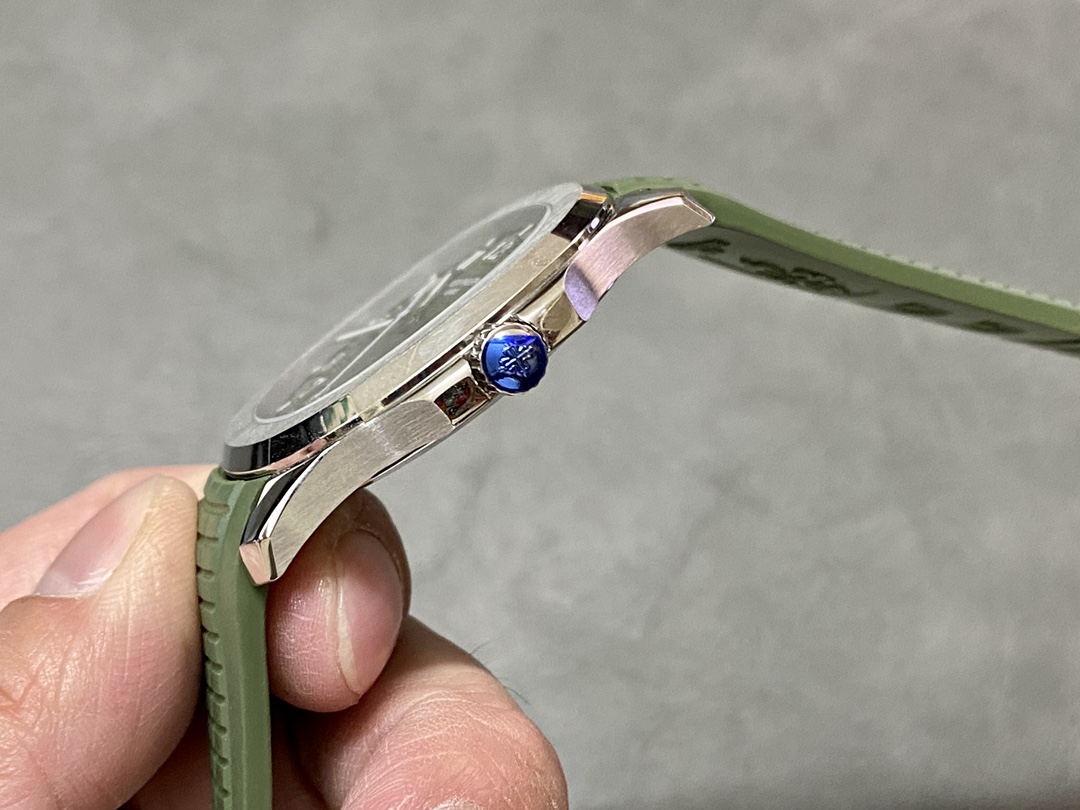 Side angle in hand of Patek Philippe Aquanaut 5168G-010 showing crown and lug curve.