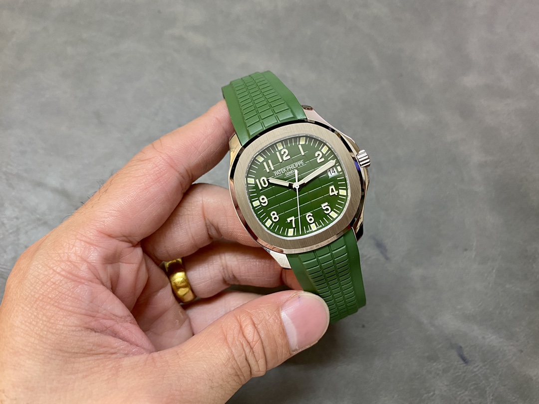 Outdoor hand-held shot of Patek Philippe Aquanaut 5168G-010 showing full watch silhouette.