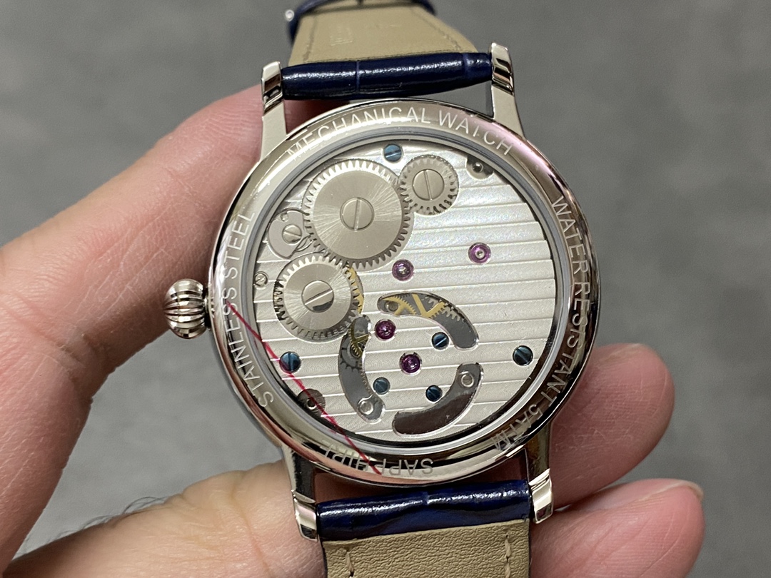 Caseback view of Patek Philippe 6102P 001 showing celestial calendar dial and engravings.