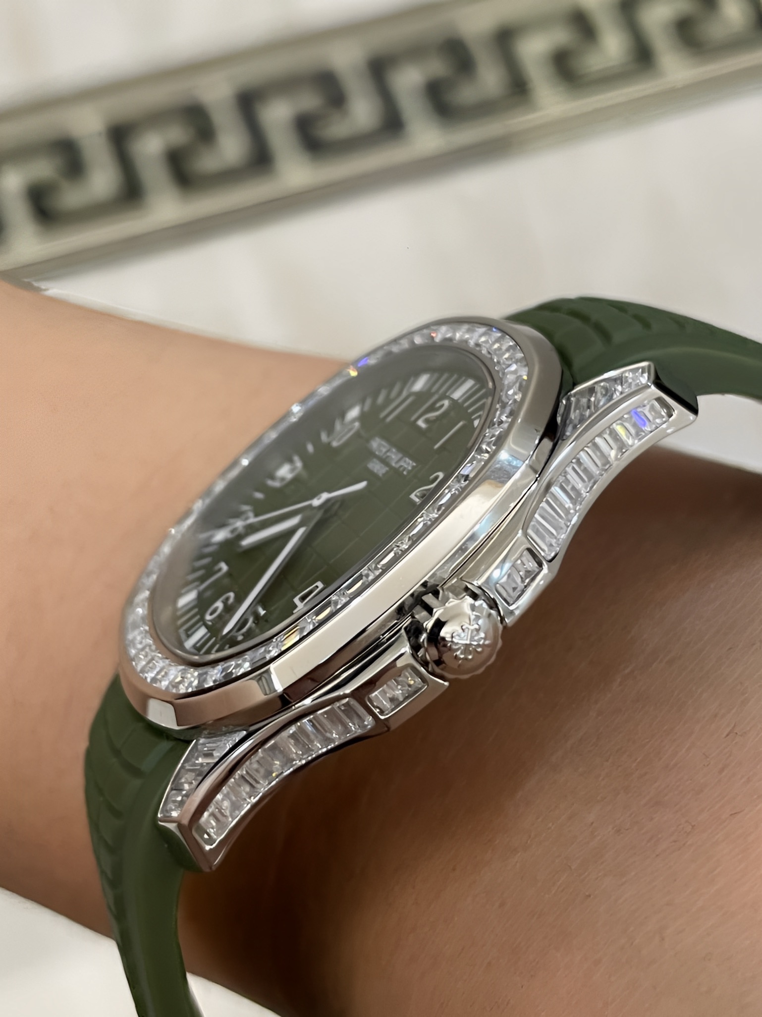 Side profile of Patek Philippe Aquanaut 5167/300G-010 showing crown side and strap curvature.