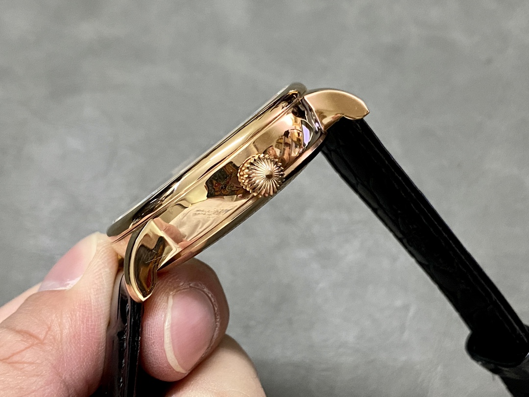 Patek Philippe Sky Moon Tourbillon 6102P 001, crown close-up showing engraved logo on the case side.