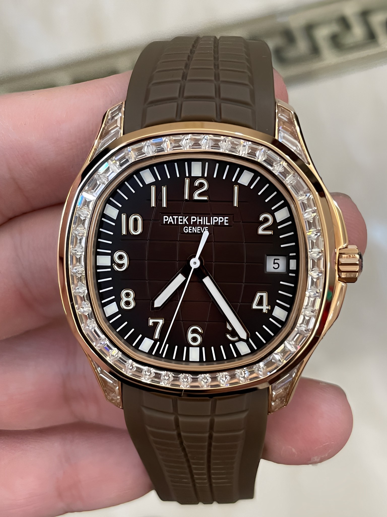 Front view of Patek Philippe Aquanaut 5167/300G-010, brown embossed dial with diamond-set bezel.