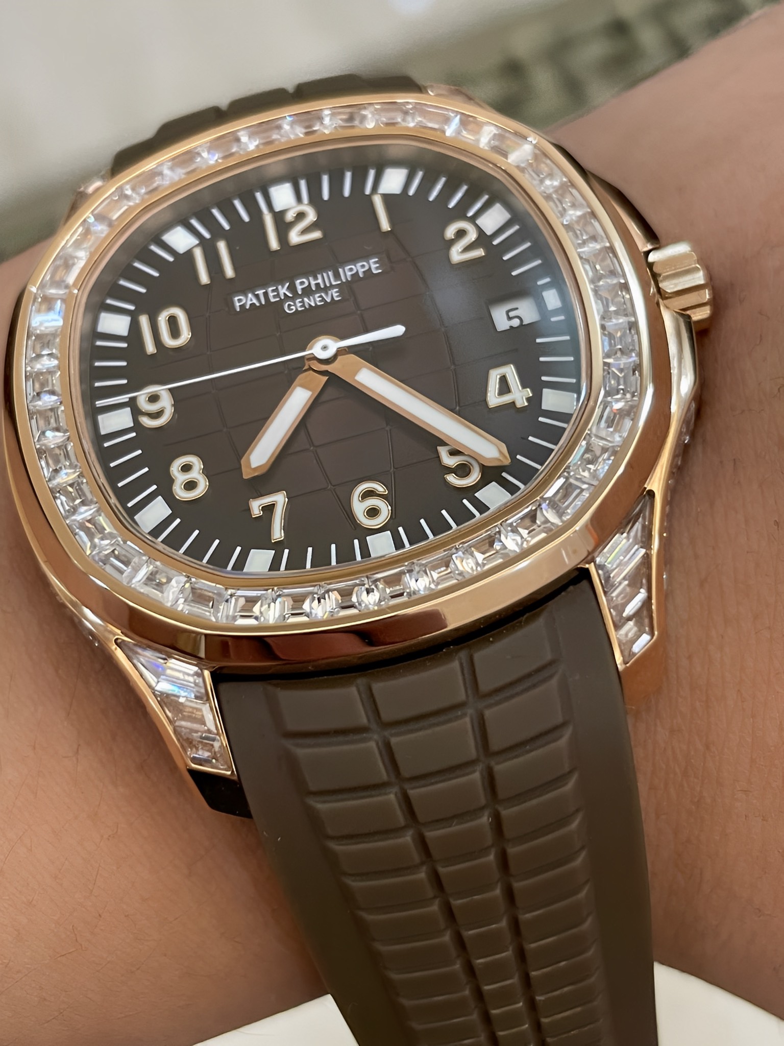Side angle of Patek Philippe Aquanaut 5167/300G-010 showing diamond bezel height and case profile.