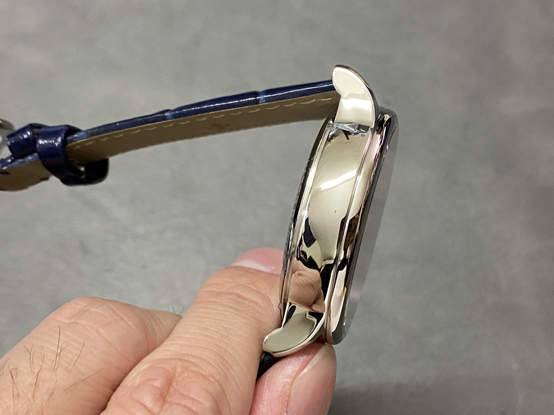 Side profile of Patek Philippe 6102P 001 highlighting white gold case thickness and lugs.