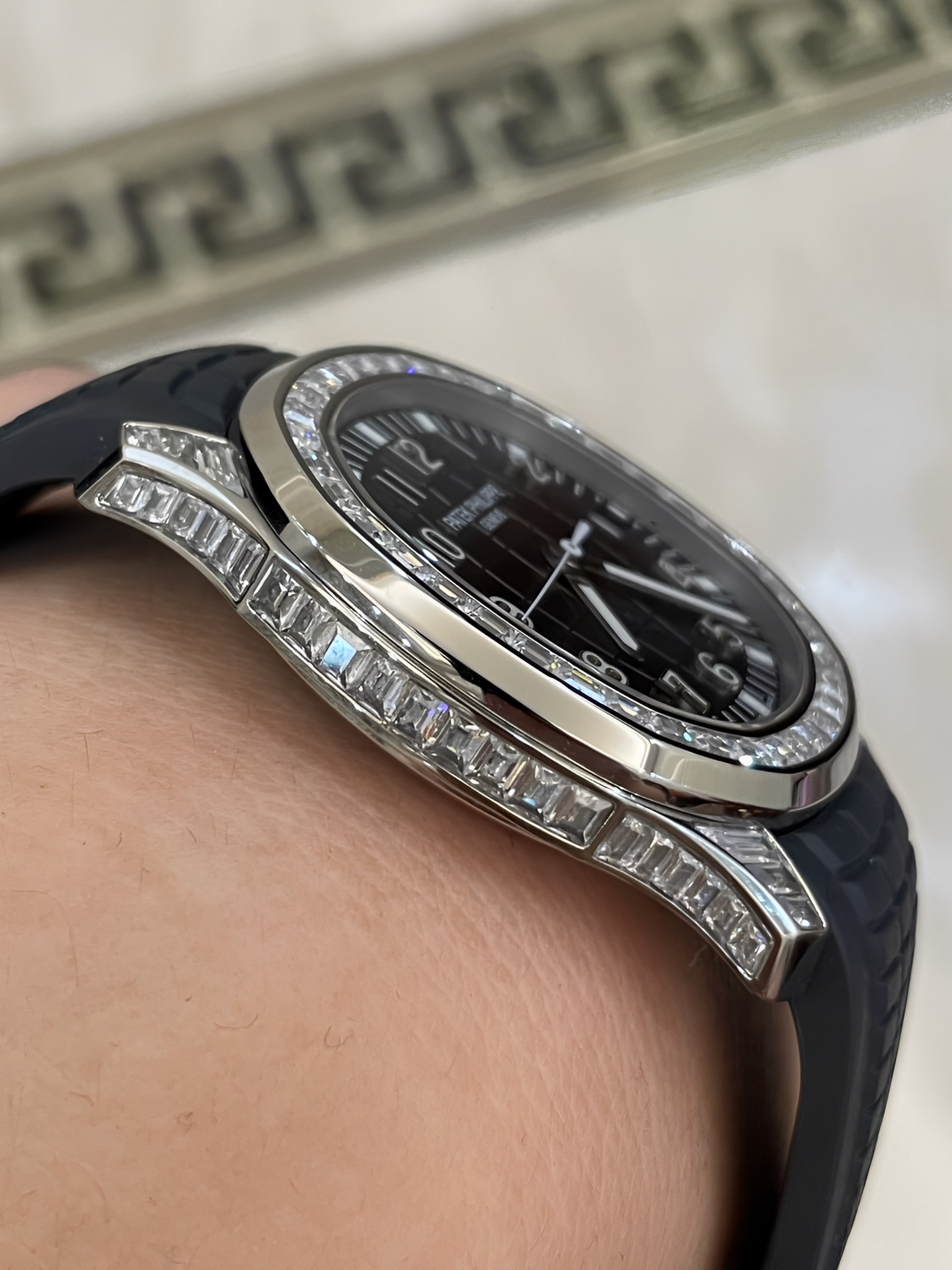 Side view of Patek Philippe Aquanaut 5167/300G-010 showing case thickness and diamond bezel profile.