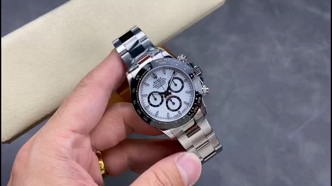 Rolex Daytona M126500LN-0001 video, handheld view of white dial and black bezel. - Video