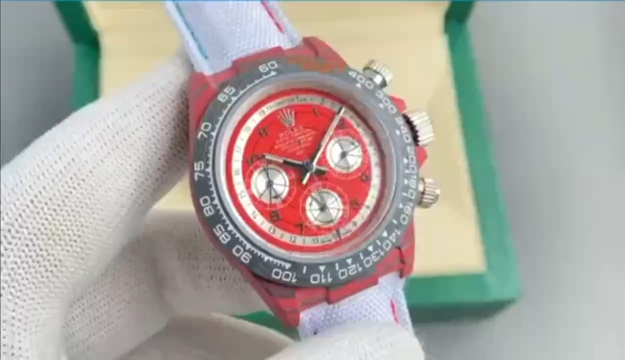 Video of Rolex Daytona DiW Oyster Red Quartz showing red dial and carbon case. - Video