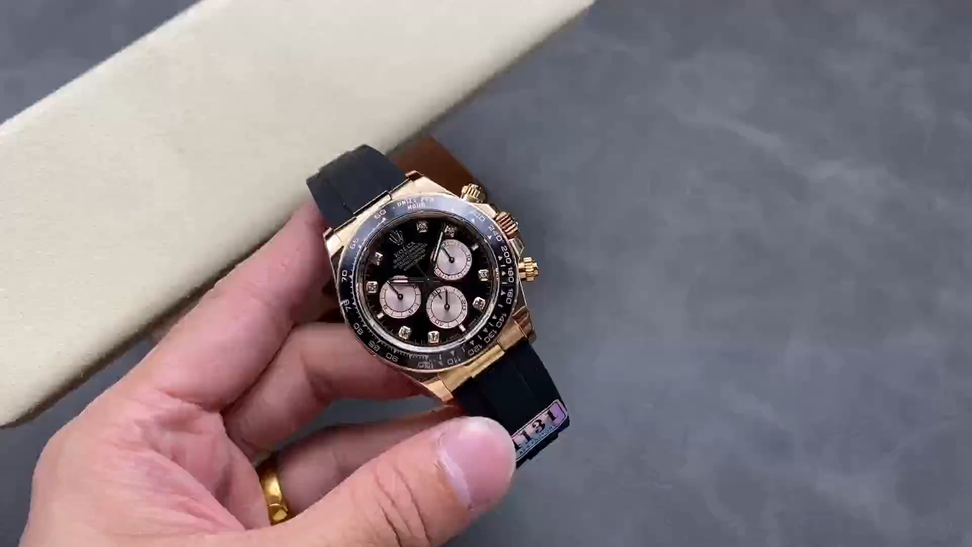 Full watch view of the Rolex Daytona Everose Rubber 126515LN 0004 shown on wrist, black dial visible. - Video