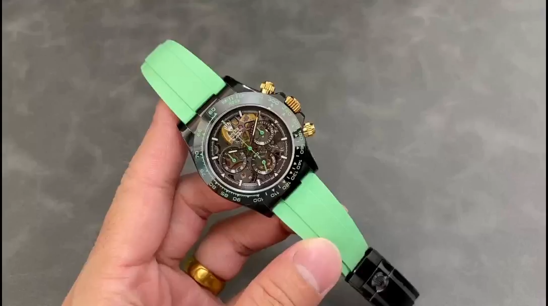 Rolex Daytona GET, hand-held view showing green rubber strap and black ceramic bezel. - Video