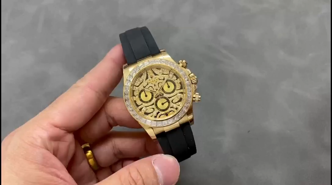 Video: hand holding Rolex Daytona 116588, skeleton dial and gold case visible. - Video