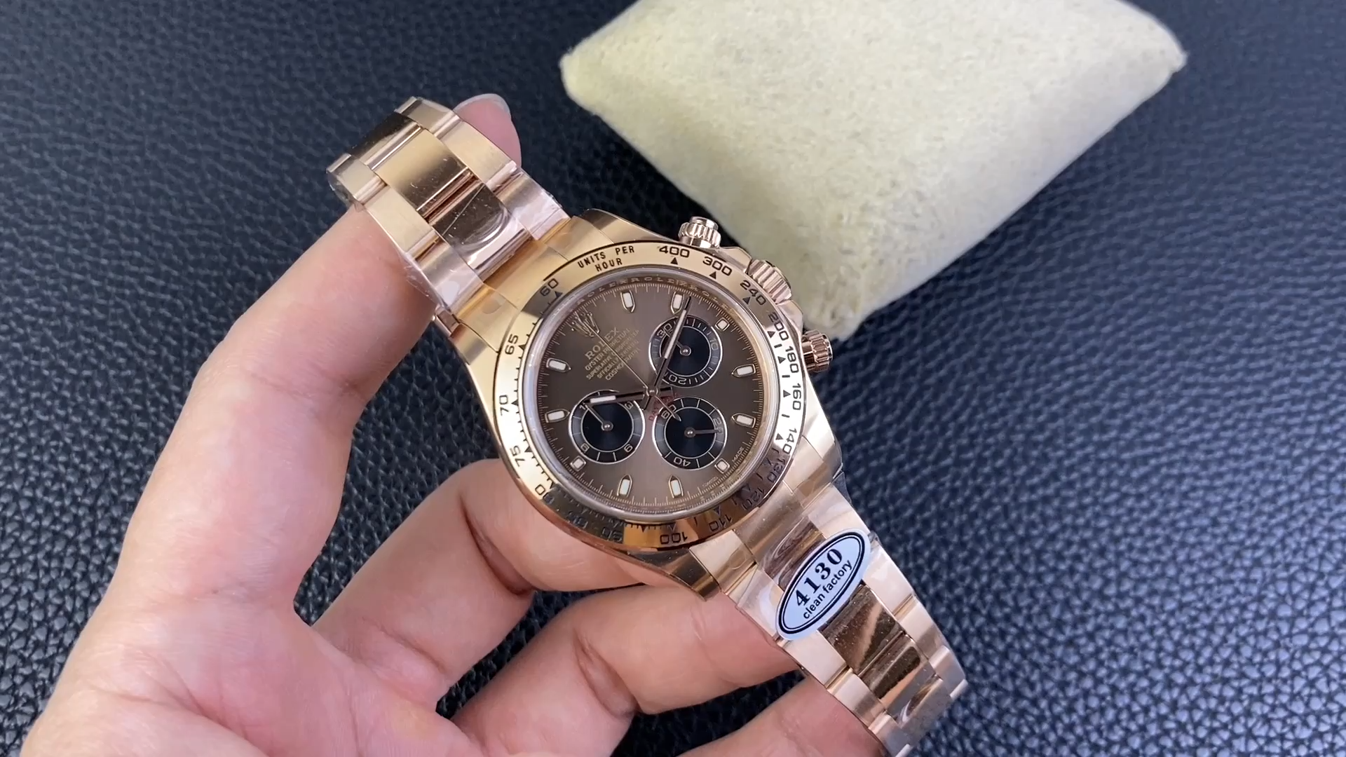 Rolex Daytona 116505 handheld shot, black ceramic-style bezel and chocolate dial visible. - Video