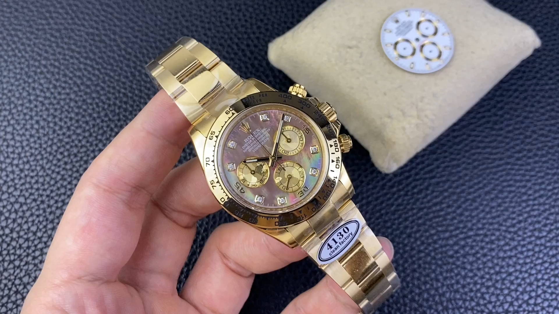 Video: hand holding Rolex Daytona 116508 showing black mother of pearl dial. - Video