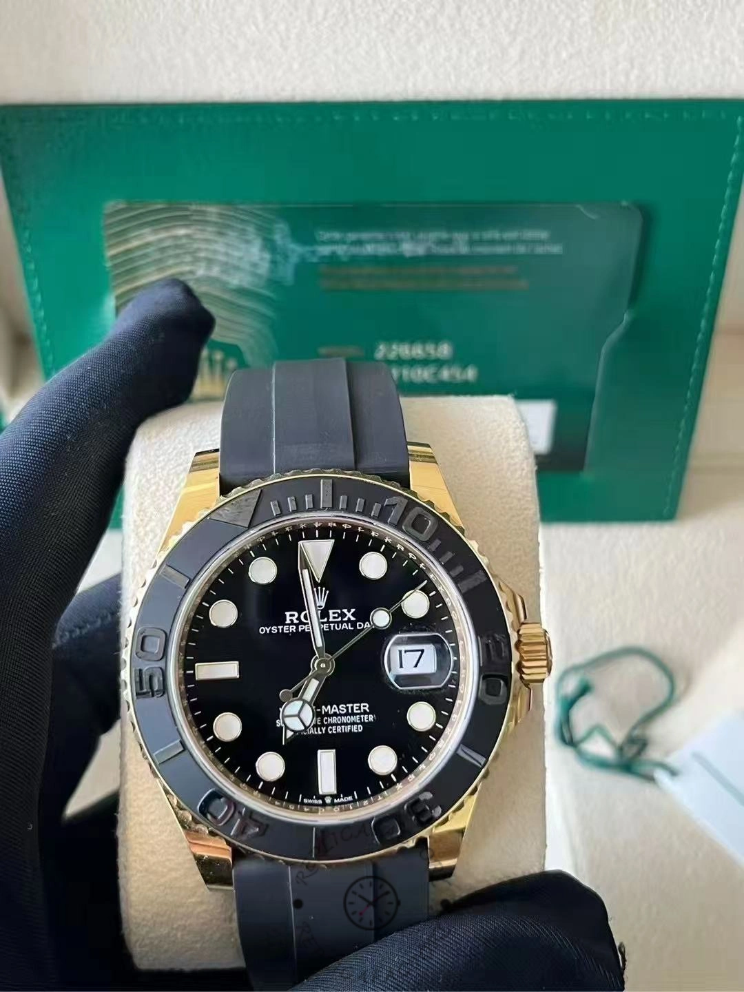 Rolex Yacht-Master M226658 0001 in box set display, watch on strap with accessories behind.