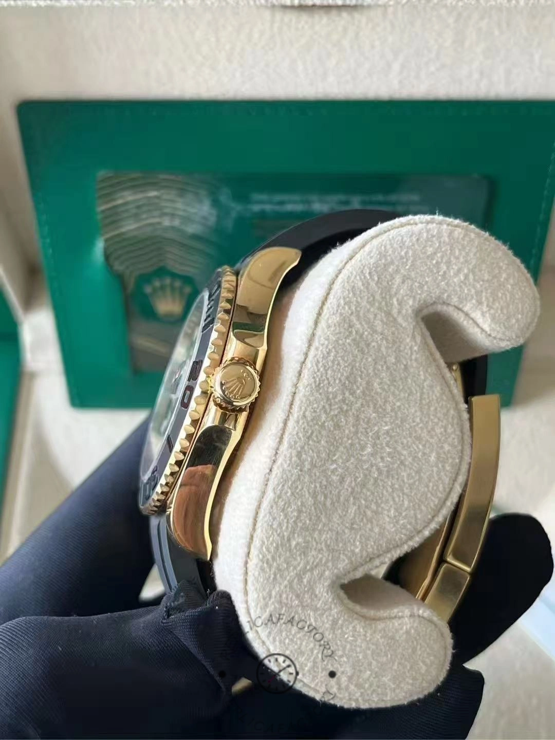 Rolex Yacht-Master M226658 0001 on display pillow, side angle with box in background.