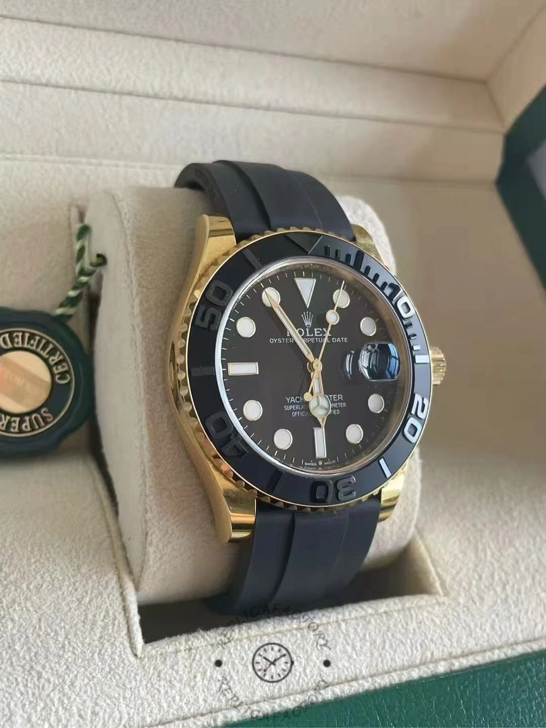 Angled view of the Rolex Yacht-Master M226658 0001 on cushion, gold case and black bezel.
