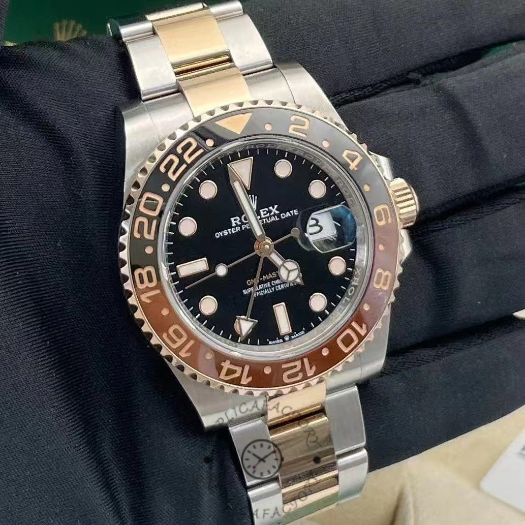 Wrist shot of Rolex GMT-Master II 126711CHNR, black dial with two-tone case and bracelet.