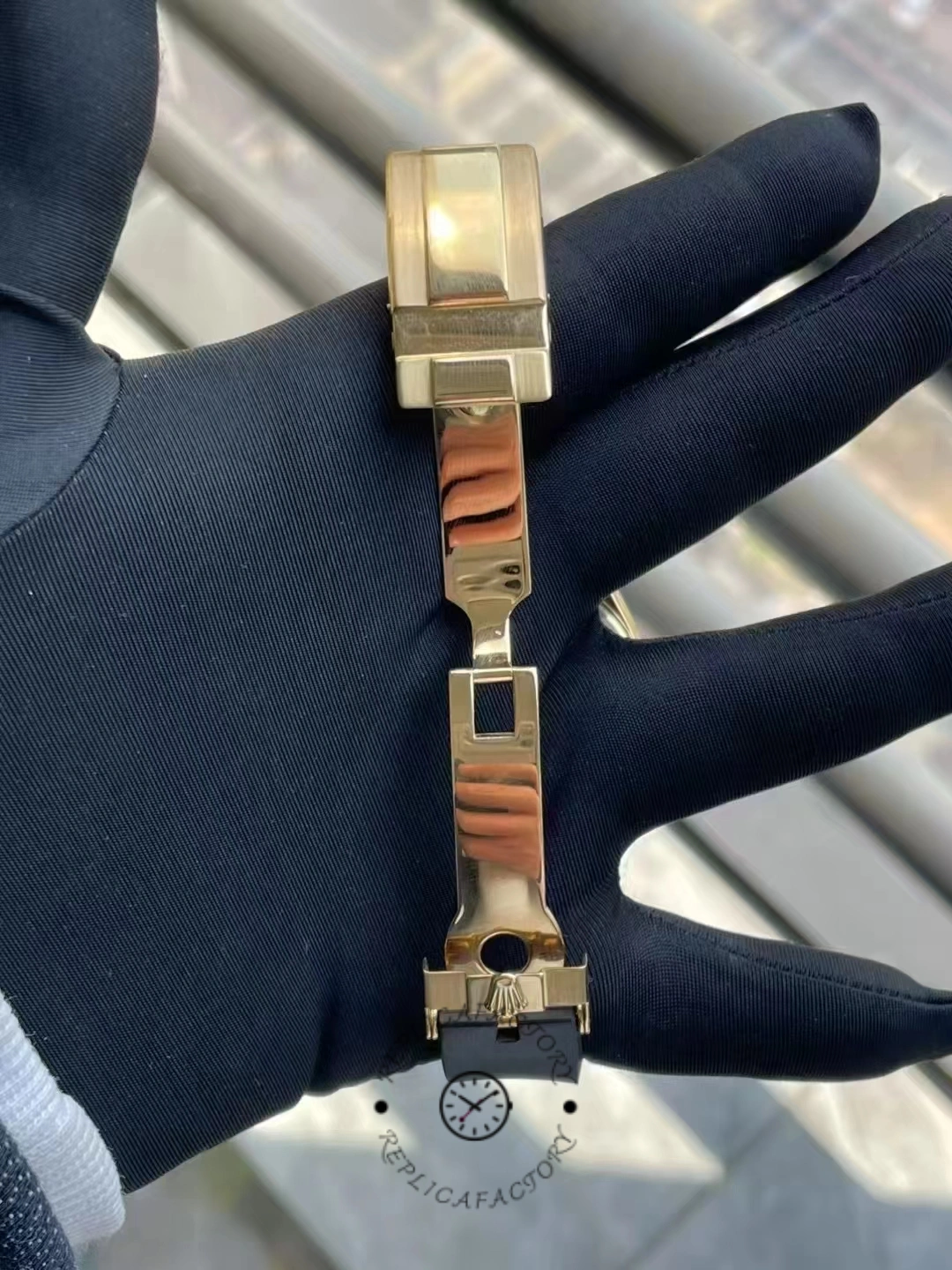 Strap and buckle view of Rolex Daytona 116598RBOW showing gold clasp hardware.
