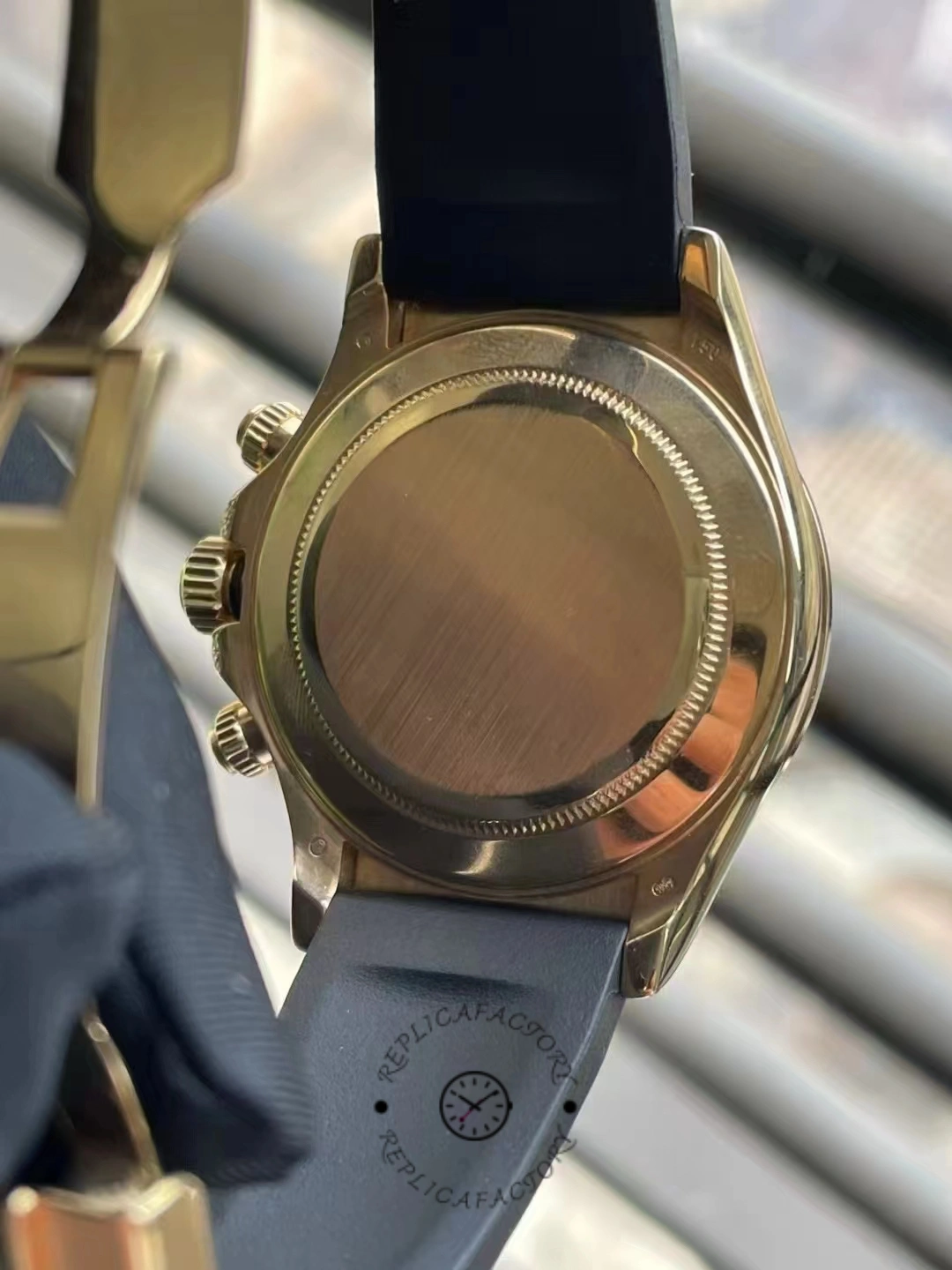 Case back view of Rolex Daytona 116598RBOW showing solid gold back and Oysterflex fit.